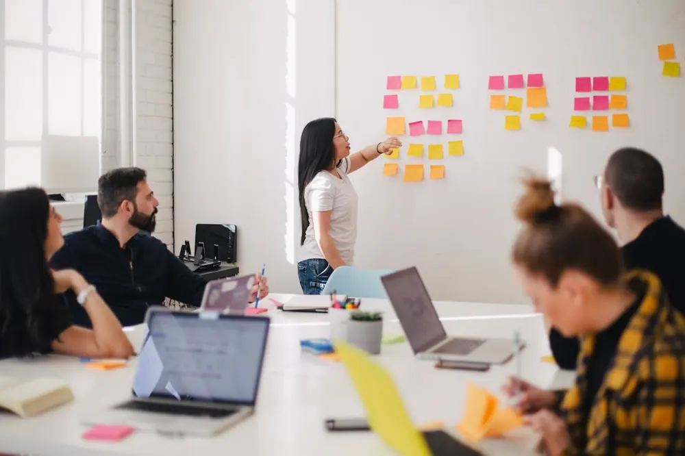 A working session at the whiteboard, mapping a sales pipeline